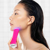 Person using Foreo Blue Light Therapy Acne Treatment Device To Clear Up A Pimple On Face. 